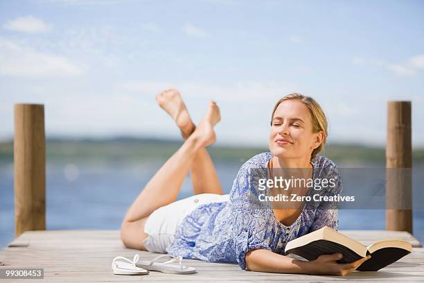 woman at a lake - hermanus stock pictures, royalty-free photos & images