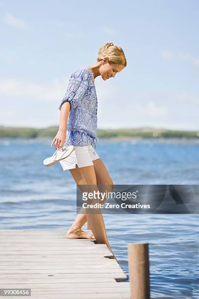woman at a lake - hermanus stock pictures, royalty-free photos & images