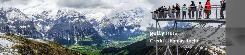 Grindelwald, Switzerland 5/17/2018 Tourists line up on the cantilevered walkway for a chance to snap the perfect selfie
