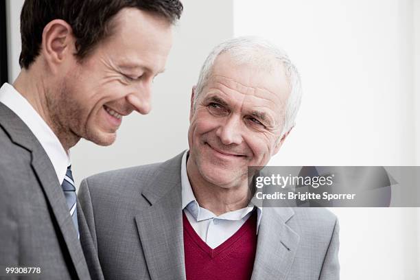 businessmen talking - brigitte sporrer stock pictures, royalty-free photos & images