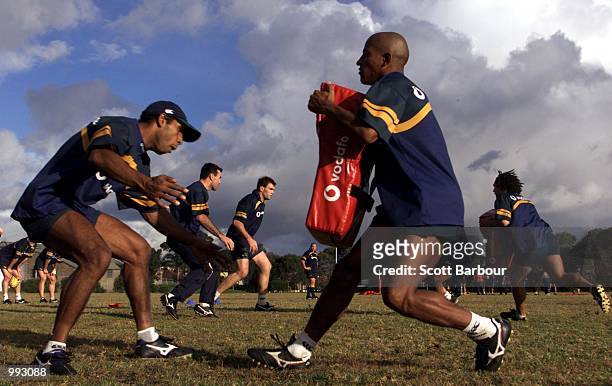 Andrew Walker and George Gregan practice their tackling during the Australian Wallabies training session at Randwick Army Barracks in preparation for...