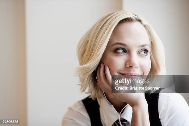 woman with earphones - brigitte sporrer stock pictures, royalty-free photos & images
