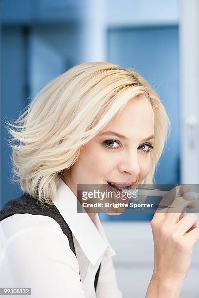 businesswoman with pen - brigitte sporrer stock pictures, royalty-free photos & images