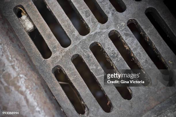 grate - manhole stock pictures, royalty-free photos & images
