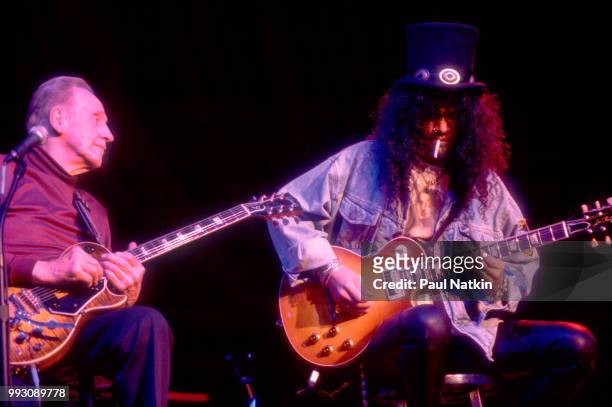 Guitarists Les Paul and Slash perform together onstage at the House of Blues, Chicago, Illinois, December 2, 1996.