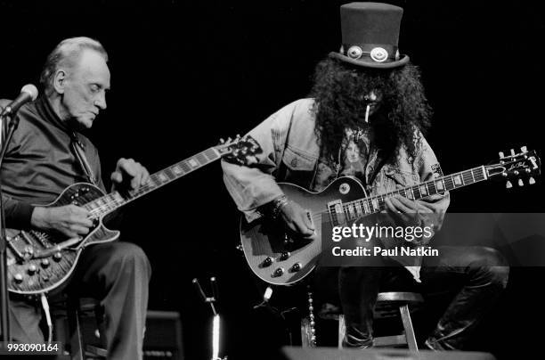 Guitarists Les Paul and Slash perform together onstage at the House of Blues, Chicago, Illinois, December 2, 1996.