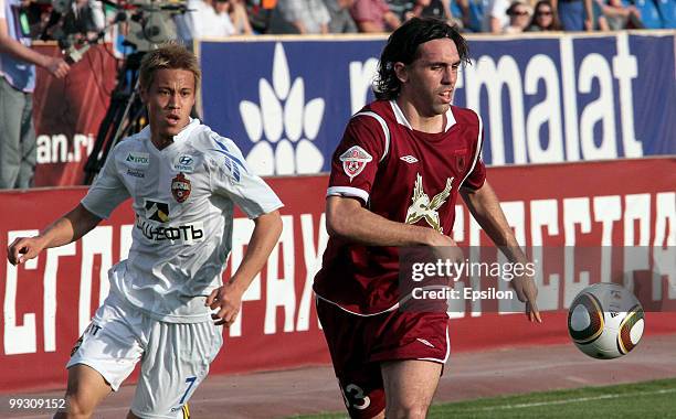 Jordi of FC Rubin Kazan battles for the ball with Keisuke Honda of PFC CSKA Moscow during the Russian Football League Championship match between FC...