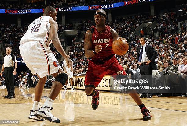 Jermaine O'Neal of the Miami Heat makes a move to the basket against Theo Ratliff of the Charlotte Bobcats during the game at Time Warner Cable Arena...