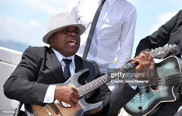 Staff Benda Bilili perform during a photo call held at the Palais Stephanie Roof Terrace during the 63rd Annual International Cannes Film Festival on...