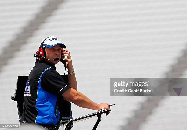 Chad Knaus, crew chief for the Lowe's Chevrolet, watches from on top of the team hauler during practice for the NASCAR Sprint Cup Series Autism...