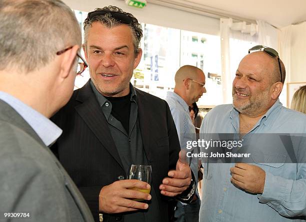 Director Eran Riklis and actor Danny Huston talk to guests as they attend the Danny Huston Press Breakfast held at the Moet Salon, Baoli Beach during...