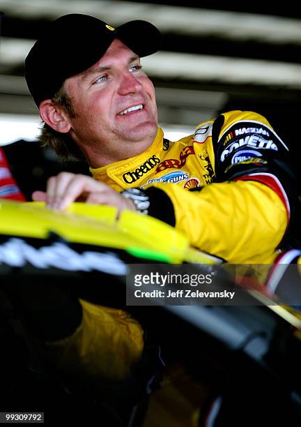 Clint Bowyer, driver of the Cheerios/Hamburger Helper Chevrolet, gets in his car in the garage during practice for the NASCAR Sprint Cup Series...