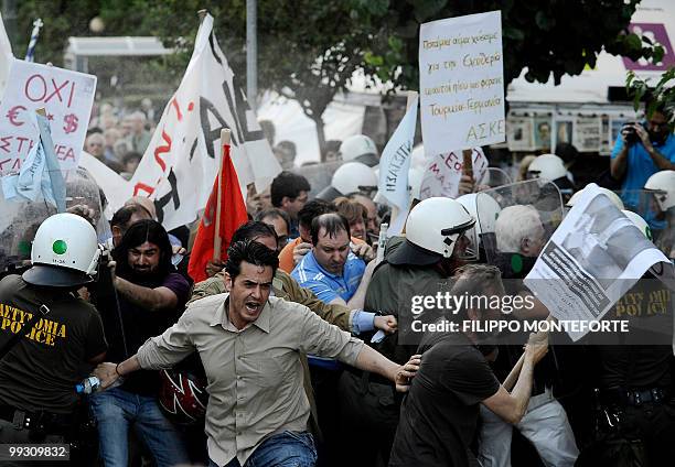 Kurdish and Armenian protestors clash with Greek police during a demonstration against Turkish Prime Minister Recep Tayyip Erdogan during his visit,...