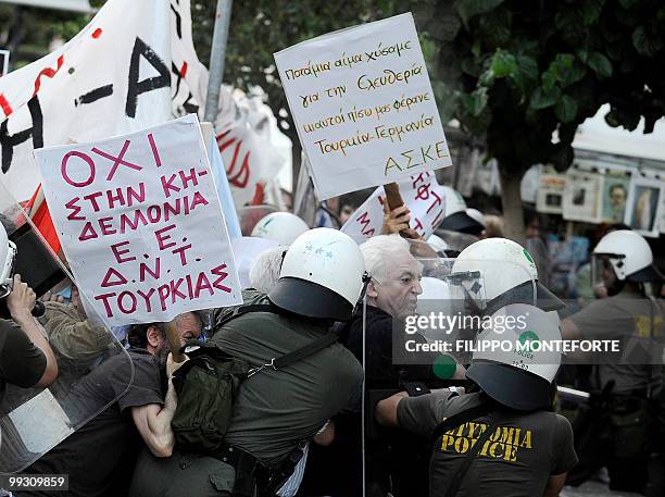 Kurdish and Armenian protestors clash with greek police during a demonstration against Turkish Prime Minister Recep Tayyip Erdogan during his visit...