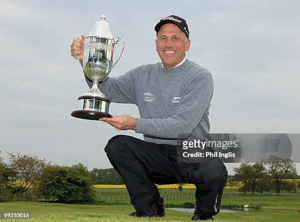 Bill Longmuir of Scotland poses with the trophy after the final round of the Handa Senior Masters presented by The Stapleford Forum played at...
