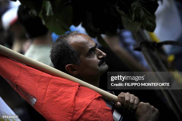 Kurdish demonstrator holds a flag during a joint Kurdish and armenian protest against Turkish Prime Minister Recep Tayyip Erdogan's visit in central...