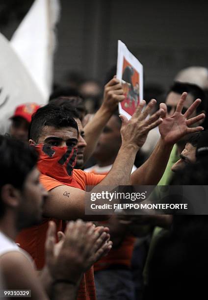 Kurdish men shouts slogans to Greek police during a Kurdish and Armenian demonstration against Turkish Prime Minister Recep Tayyip Erdogan's visi in...