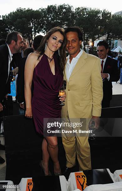 Actress Liz Hurley and husband Arun Nayar attend the Amber Fashion Show and Auction held at the Meridien Beach Plaza on May 14, 2010 in Monte Carlo,...
