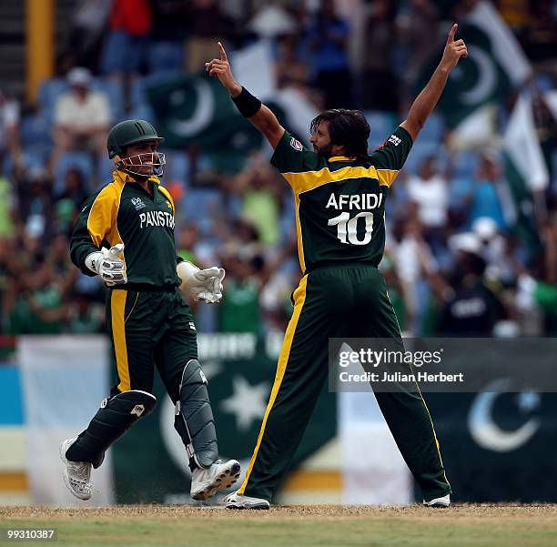 Kamran Akmal and Shahid Afridi of Pakistan ofcelebrate the dismissal Michael Clarke during the semi final of the ICC World Twenty20 between Australia...