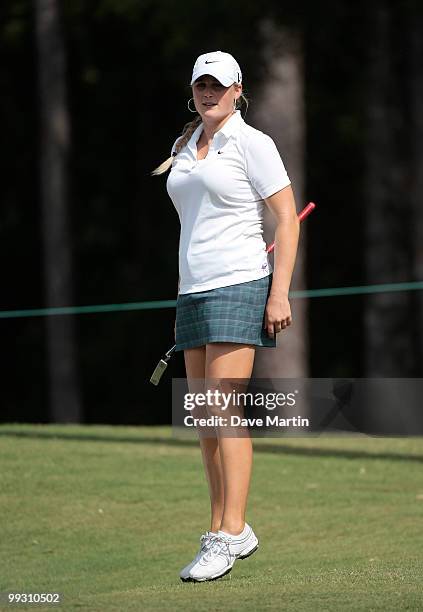 Amanda Blumenherst jumps as she watches her putt on the 18th green during second round play in the Bell Micro LPGA Classic at the Magnolia Grove Golf...