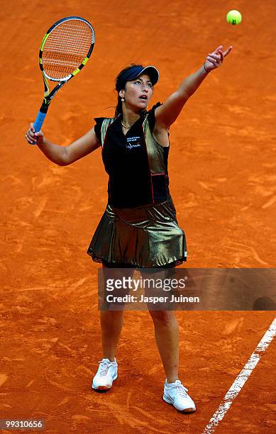 Aravane Rezai of France serves the ball to Jelena Jankovic of Serbia in their quarter final match during the Mutua Madrilena Madrid Open tennis...