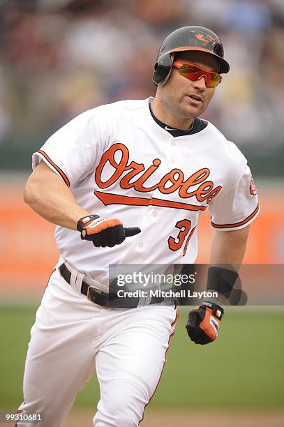 Luke Scott of the Baltimore Orioles runs to third base during a baseball game against the Seattle Mariners on May 13, 2010 at Camden Yards in...