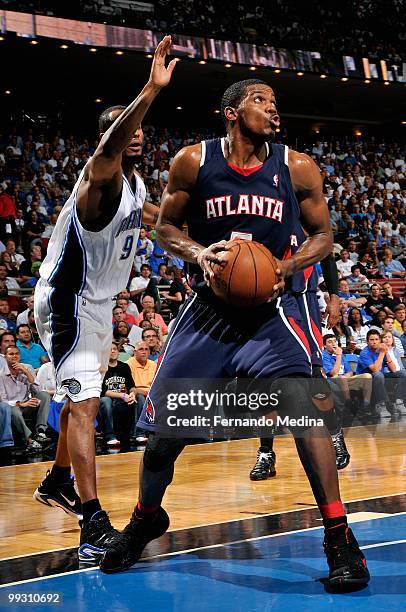 Joe Johnson of the Atlanta Hawks drives past Rashard Lewis of the Orlando Magic in Game One of the Eastern Conference Semifinals during the 2010...