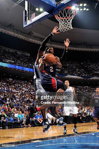 Joe Johnson of the Atlanta Hawks looks to pass the ball under the basket in Game One of the Eastern Conference Semifinals against the Orlando Magic...