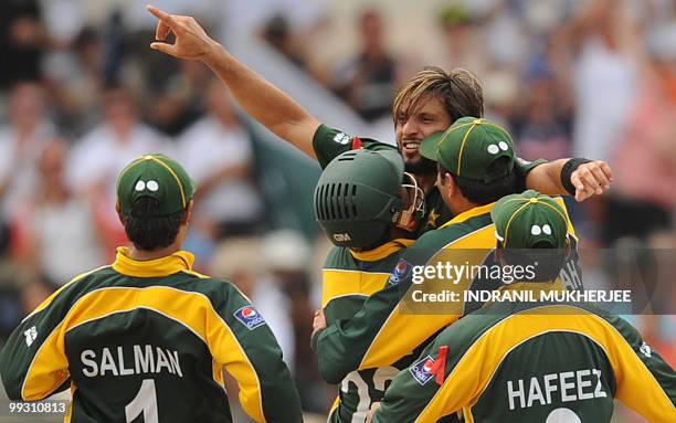 Pakistan captain Shahid Afridi celebrates the wicket of Australian cricketer Michael Clarke during the ICC World Twenty20 second semifinal match...