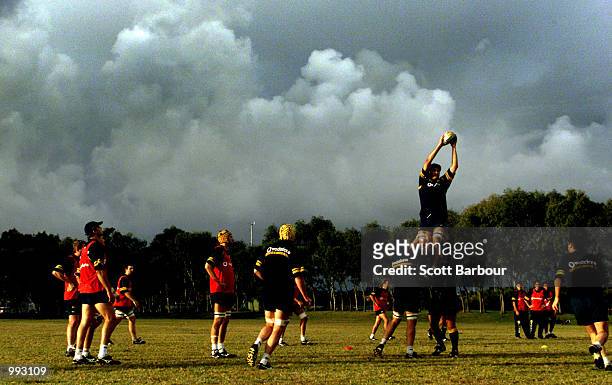John Eales goes high to take the ball in lineout training during the Australian Wallabies training session at Randwick Army Barracks in preparation...