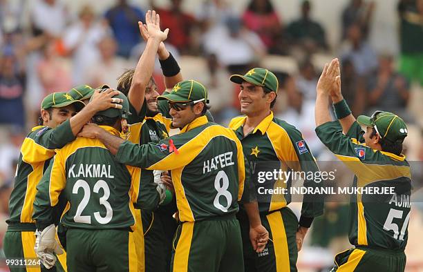 Pakistan captain Shahid Afridi celebrates the wicket of Australian cricketer Michael Clarke during the ICC World Twenty20 second semifinal match...