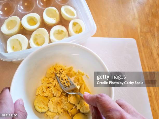 making deviled eggs - deviled egg stock pictures, royalty-free photos & images