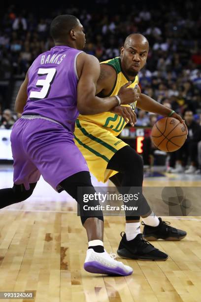 Andre Owens of Ball Hogs drives with the ball against Marcus Banks of Ghost Ballers during week three of the BIG3 three on three basketball league...