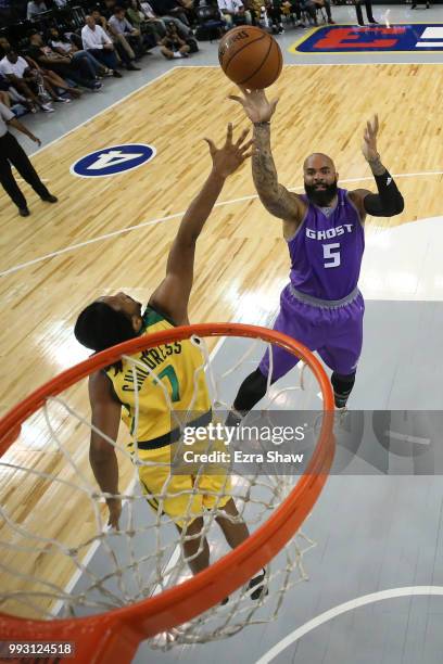 Carlos Boozer of Ghost Ballers shoots against Josh Childress of Ball Hogs during week three of the BIG3 three on three basketball league game at...