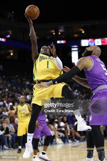 Jermaine Taylor of Ball Hogs throws up a shot against Carlos Boozer of Ghost Ballers during week three of the BIG3 three on three basketball league...