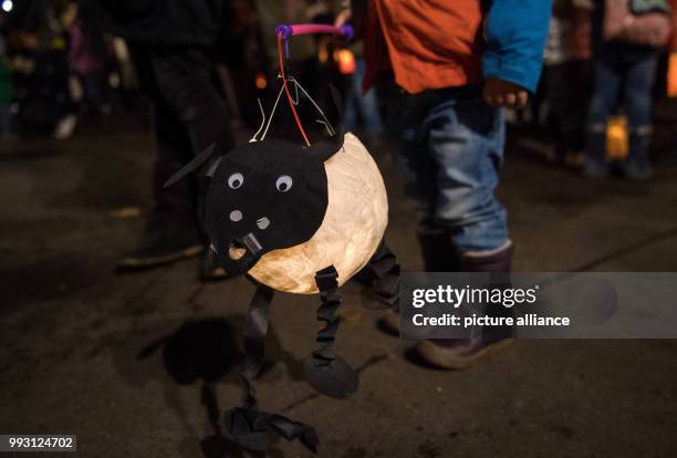 Jakob holds a sheep lantern in his hand during the St. Martin's parade in Stuttgart, Germany, 08 November 2017. Already before the actual St....