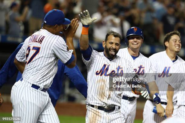 Jose Bautista of the New York Mets celebrates his walk off Grand Slam home run against the Tampa Bay Rays during their game at Citi Field on July 6,...