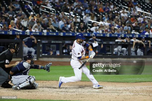 Jose Bautista of the New York Mets hits a walk off Grand Slam home run against the Tampa Bay Rays during their game at Citi Field on July 6, 2018 in...