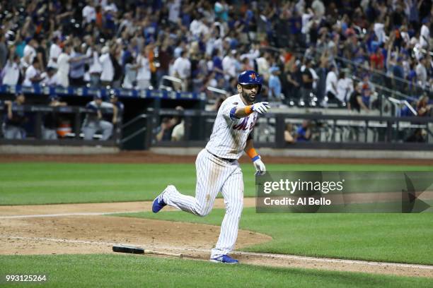 Jose Bautista of the New York Mets celebrates his walk off Grand Slam home run against the Tampa Bay Rays during their game at Citi Field on July 6,...