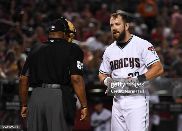 Steven Souza Jr of the Arizona Diamondbacks talks with home plate umpire Laz Diaz after being called out on strikes during the first inning against...