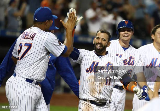 Jose Bautista of the New York Mets celebrates his walk off Grand Slam home run against the Tampa Bay Rays during their game at Citi Field on July 6,...