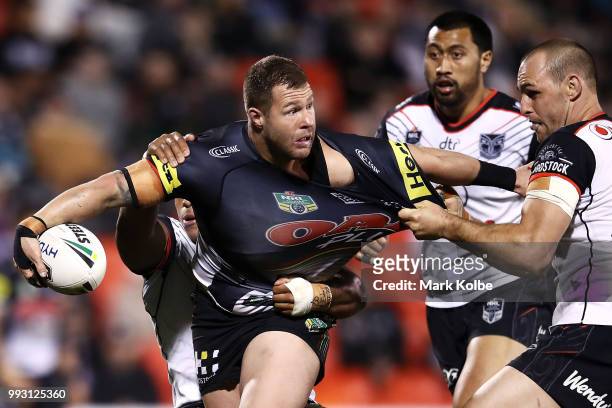 Trent Merrin of the Panthers is tackled during the round 17 NRL match between the Penrith Panthers and the New Zealand Warriors at Panthers Stadium...