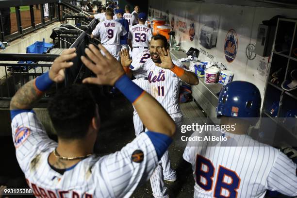 Jose Bautista of the New York Mets celebrates his walk off Grand Slam home run with Asdrubal Cabrera against the Tampa Bay Rays during their game at...