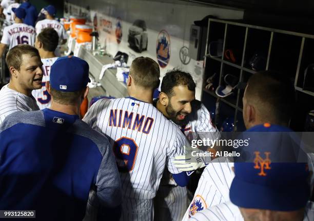 Jose Bautista of the New York Mets celebrates his walk off Grand Slam home run with Brandon Nimmo against the Tampa Bay Rays during their game at...