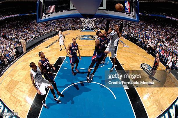 Dwight Howard of the Orlando Magic shoots over Josh Smith of the Atlanta Hawks in Game One of the Eastern Conference Semifinals during the 2010...