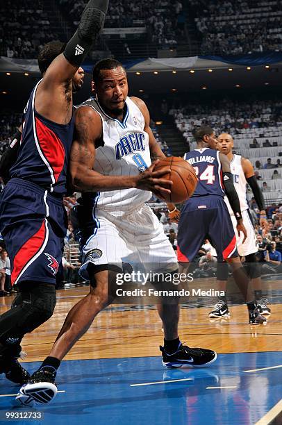 Rashard Lewis of the Orlando Magic drives to the basket against Josh Smith the Atlanta Hawks in Game One of the Eastern Conference Semifinals during...