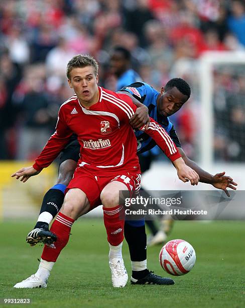 Danny Ward of Swindon holds off Jose Semedo of Charlton during the Coca-Cola League One Playoff Semi Final 1st leg match between Swindon Town and...