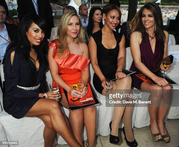 Jade Ewen, Heidi Range and Amelle Berrabah of the Sugababes meet with actress Liz Hurley at the Amber Fashion Show and Auction held at the Meridien...
