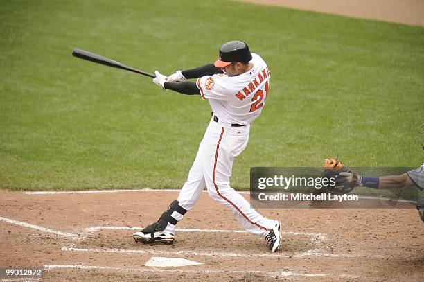 Nick Markakis of the Baltimore Orioles takes a swing during a baseball game against the Seattle Mariners on May 13, 2010 at Camden Yards in...