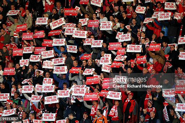 Swindon fans show their support during the Coca-Cola League One Playoff Semi Final 1st leg match between Swindon Town and Charlton Athletic at The...